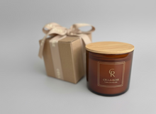 Load image into Gallery viewer, Brown candle with wooden lid and matching gift box on a marble surface